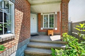 Ottawa apartment for rent - A brick house with a white door and a small porch.