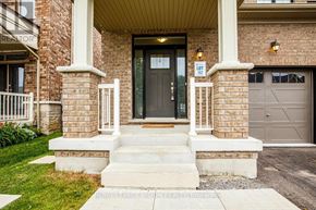 Whitby (Rolling Acres) apartment for rent - A brick house with a black door and a sign that says "Lot 10".