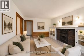 Toronto (Woodbine Corridor) condo for rent - A living room with a fireplace and a couch.