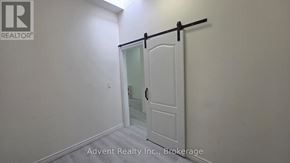 Toronto (Roncesvalles) apartment for rent - A white door with a black handle is in a room with white walls.
