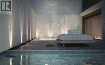 Toronto (Annex) condo for rent - A bedroom with a bed and a pool in the foreground.