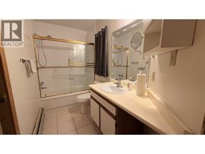 Vancouver apartment for rent - A bathroom with a sink, mirror, and shower.