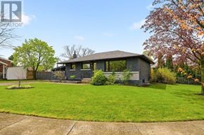 St. Catharines (Glendale/Glenridge) apartment for rent - A house with a grey roof and a green lawn in front.