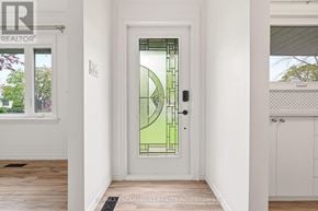 St. Catharines (Glendale/Glenridge) apartment for rent - A white door with a glass window and a black handle.