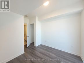 Toronto (Waterfront Communities) condo for rent - A room with a VIP Bay Realty Inc. logo on the wall.