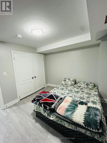 Brampton (Northwest Brampton) apartment for rent - A bedroom with a bed and a white door.