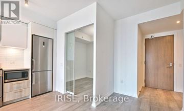 Toronto (Church-Yonge Corridor) condo for rent - A kitchen with a refrigerator, microwave, and oven.
