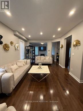 Richmond Hill (Westbrook) apartment for rent - A spacious living room with a white sofa and a coffee table.