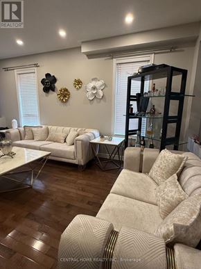 Richmond Hill (Westbrook) apartment for rent - A living room with a white sofa and a glass cabinet.