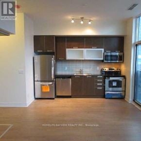Toronto (Church-Yonge Corridor) condo for rent - A kitchen with a refrigerator, microwave, oven and dishwasher.