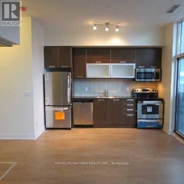 Toronto (Church-Yonge Corridor) condo for rent - A kitchen with a refrigerator, microwave, oven and dishwasher.