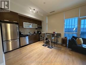 Toronto (Church-Yonge Corridor) condo for rent - A kitchen with a refrigerator, microwave, and oven.