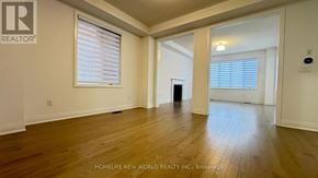 East Gwillimbury (Holland Landing) apartment for rent - A room with wooden floors and white walls, with a window covered by white blinds.