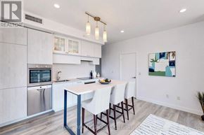Toronto (Yonge-Eglinton) condo for rent - A modern kitchen with a dining table and chairs.