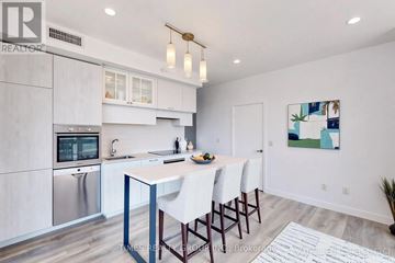 Toronto (Yonge-Eglinton) condo for rent - A modern kitchen with a dining table and chairs.