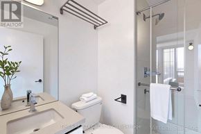 Toronto (Yonge-Eglinton) condo for rent - A bathroom with a glass shower door and a white toilet.