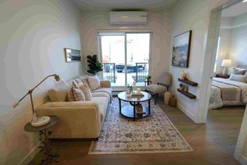 Calgary apartment for rent - A living room with a white couch and a coffee table.