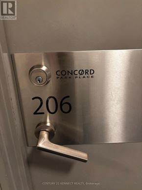 Toronto (Bayview Village) condo for rent - A stainless steel door handle with the number 206 and the word Concord on it.