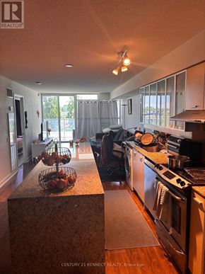 Toronto (Bayview Village) condo for rent - A kitchen with granite countertops and stainless steel appliances.