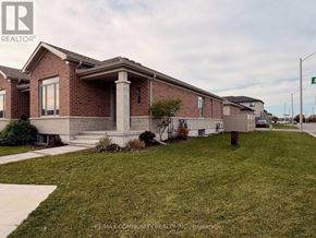 Belleville (Thurlow Ward) townhouse for rent - A house with a lawn in front of it.