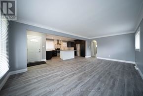 Cambridge apartment for rent - A spacious room with a grey floor and white walls.