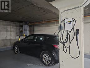 Ottawa condo for rent - A black car is charging at a station.