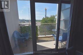 Toronto (Thorncliffe Park) condo for rent - A balcony with a table and chairs overlooking a construction site.