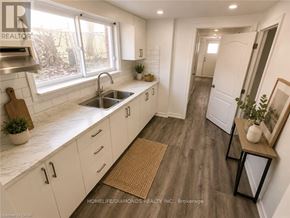 Welland (N. Welland) apartment for rent - A living room with a white couch and a wooden coffee table.
