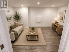 Welland (N. Welland) apartment for rent - A well-lit, spacious living room with a dining area in the background.
