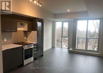 Toronto (Birchcliffe-Cliffside) condo for rent - A kitchen with a stove top oven and a refrigerator.