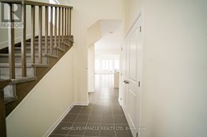 Loyalist (Bath) apartment for rent - A hallway with a staircase on the left and a door on the right.