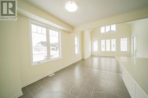 Loyalist (Bath) apartment for rent - A spacious room with tiled flooring and large windows.