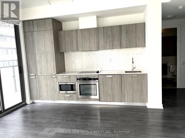 Toronto (Church-Yonge Corridor) condo for rent - A modern kitchen with wooden cabinets and stainless steel appliances.