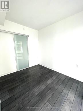 Toronto (Church-Yonge Corridor) condo for rent - A room with a glass door and wooden flooring.