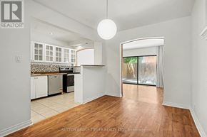 Toronto (Yonge-Eglinton) apartment for rent - A well-lit, empty room with wooden floors and white walls.