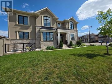 Milton (Cb Cobban) apartment for rent - A large, modern house with a well-kept lawn in front.