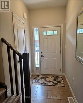 Grimsby (Grimsby Beach) townhouse for rent - A hallway with a white door and a rug on the floor.