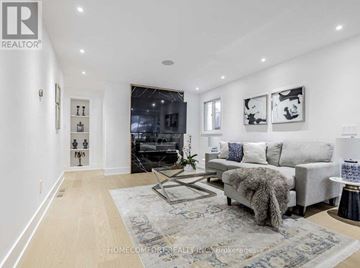 Toronto (Parkwoods-Donalda) apartment for rent - A living room with a grey couch and a rug.