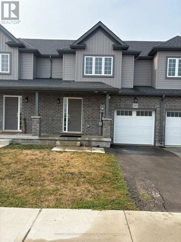 London South (South W) townhouse for rent - A grey house with a white garage door.