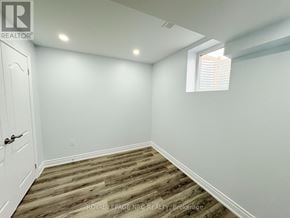 Hamilton (Stoney Creek) multi-family for rent - A room with wooden flooring and white walls.
