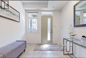 Vaughan (Vaughan Grove) townhouse for rent - A hallway with a bench, a mirror, and a door.