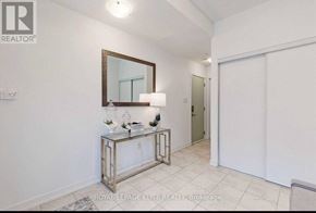 Vaughan (Vaughan Grove) townhouse for rent - A white room with a mirror and a console table.