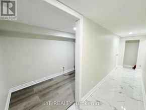 Toronto (Wexford-Maryvale) apartment for rent - A hallway with a marble floor and a grey floor in the distance.