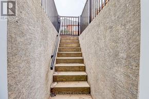 Mississauga (Meadowvale Village) apartment for rent - A staircase with a metal railing leads up to a door.