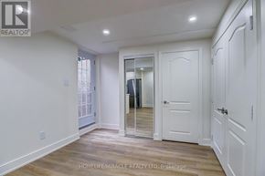 Mississauga (Meadowvale Village) apartment for rent - A white room with a sliding glass door and a mirrored door.