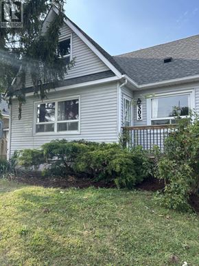 St. Catharines (Fairview) duplex for rent - A house with a sign that says "RETURN" on the top left corner.