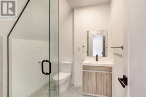 Toronto (Annex) multi-family for rent - A bathroom with a toilet, sink and mirror.