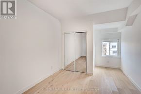 Toronto (Annex) multi-family for rent - A room with a sliding door and a window.