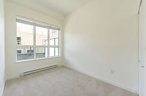 Surrey apartment for rent - A room with a window and a carpeted floor.
