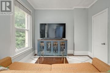 Hamilton (Central) apartment for rent - A living room with a television and a cabinet.